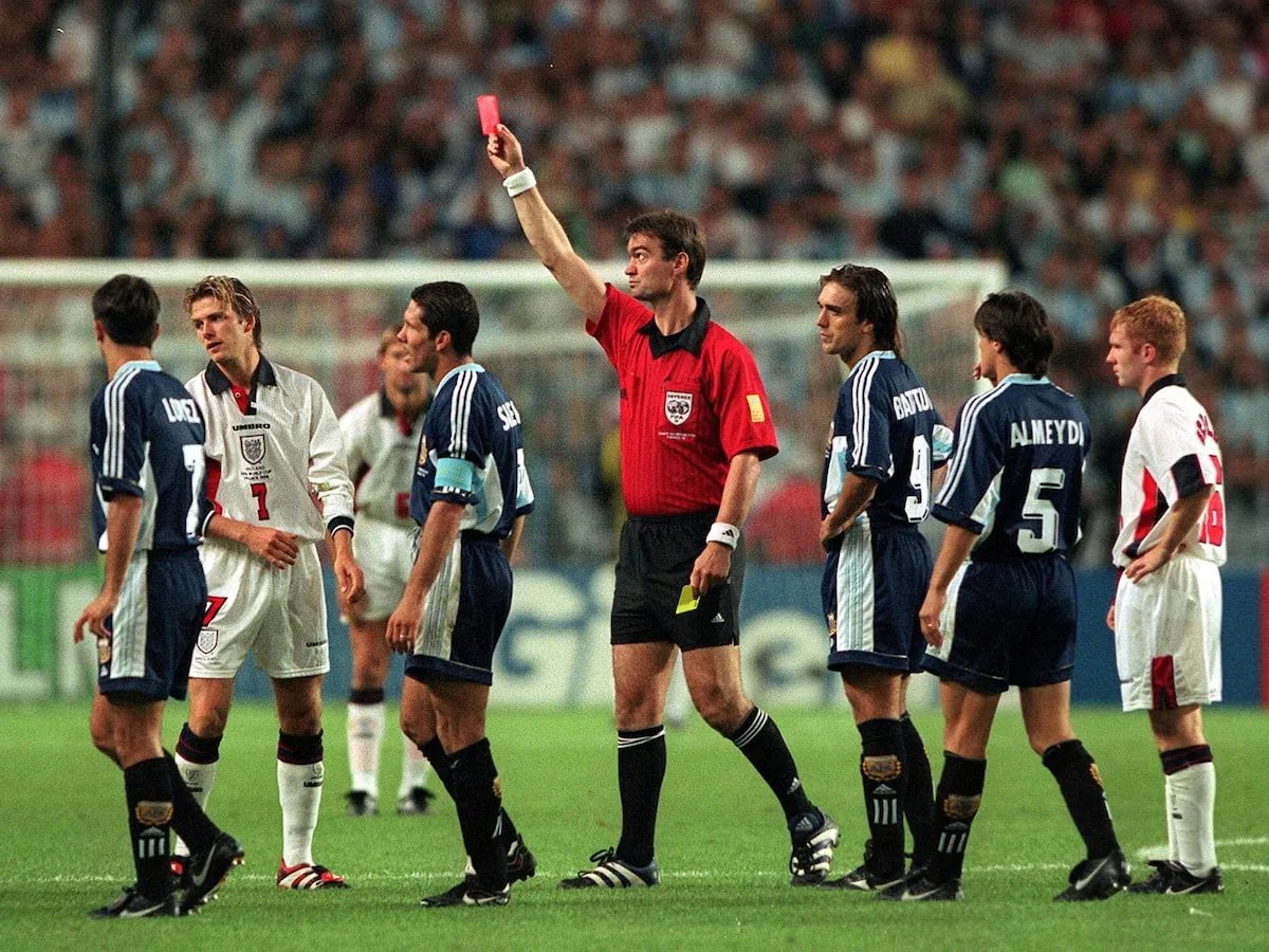 David Beckham, second from left, is shown the red card shortly after halftime.Darren Walsh