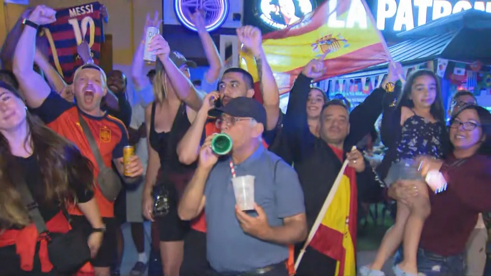 Photo shows fan celebrating on College Street in Toronto after Spain's World Cup victory.