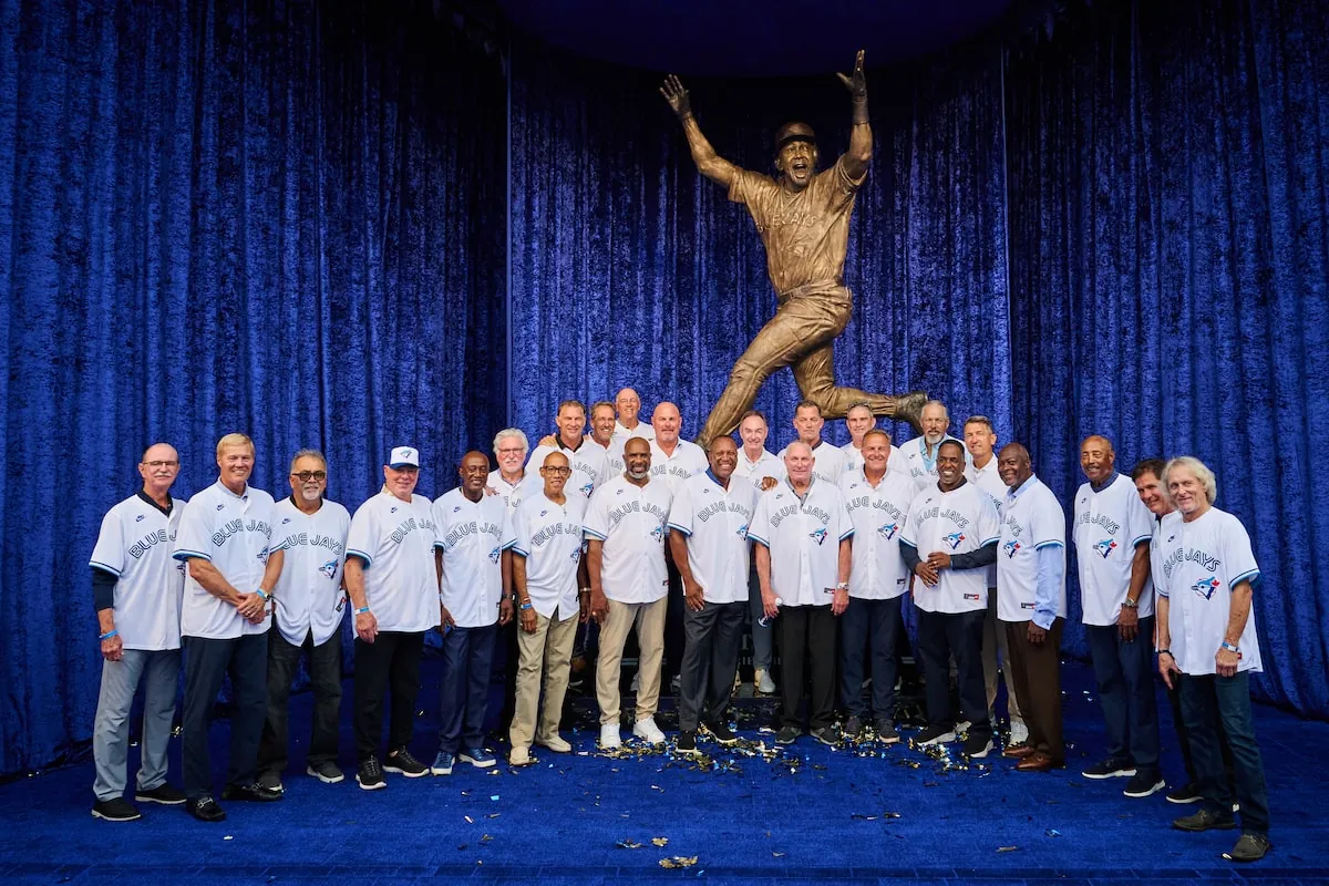 Joe Carter, centre, is joined by members of the 1992 and 1993 Blue Jays at the unveiling in Toronto on Saturday.Sammy Kogan/The Canadian Press